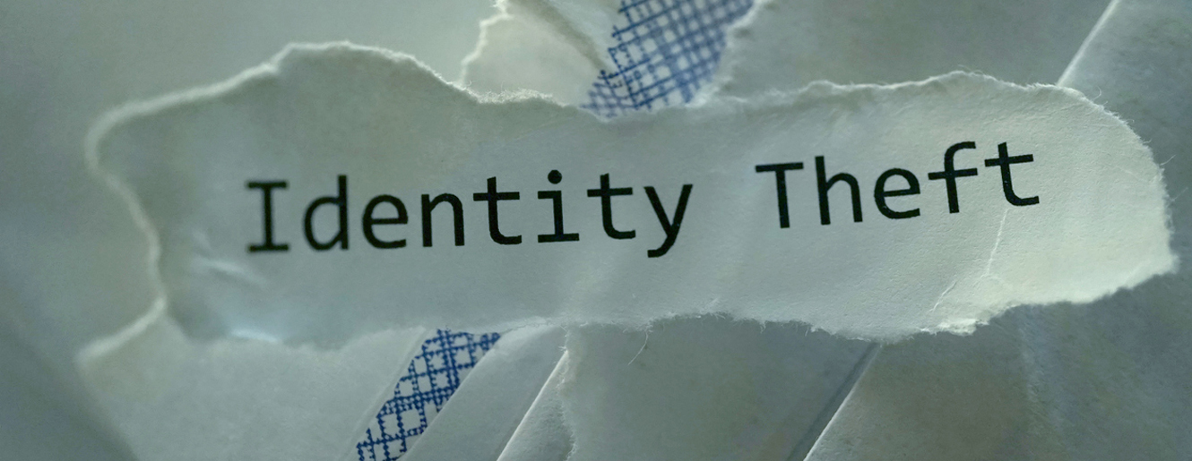Identity Theft written on a piece of paper.